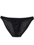 Men's black low-waist nylon briefs laid flat, showing brief-style cut and knitted fabric texture.