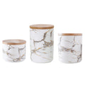 3 piece marbled ceramic jar set with wooden lids large medium and small on a countertop