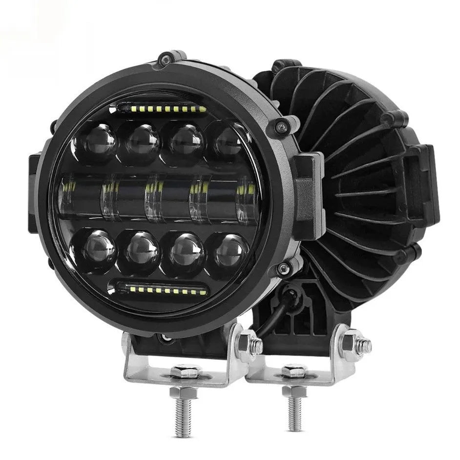 7-inch circular LED car headlight with black die-cast aluminium housing and PMMA lens on dark background