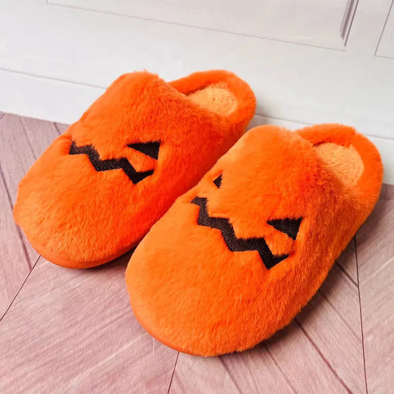 Orange coral velvet plush slippers with a non-slip PVC sole and fluffy lining.