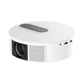 White HD home cinema projector with remote control on a table