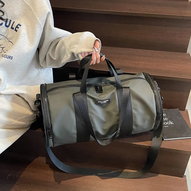 Waterproof Oxford cloth travel bag for sports and leisure in black, dark gold, and dark grey colours