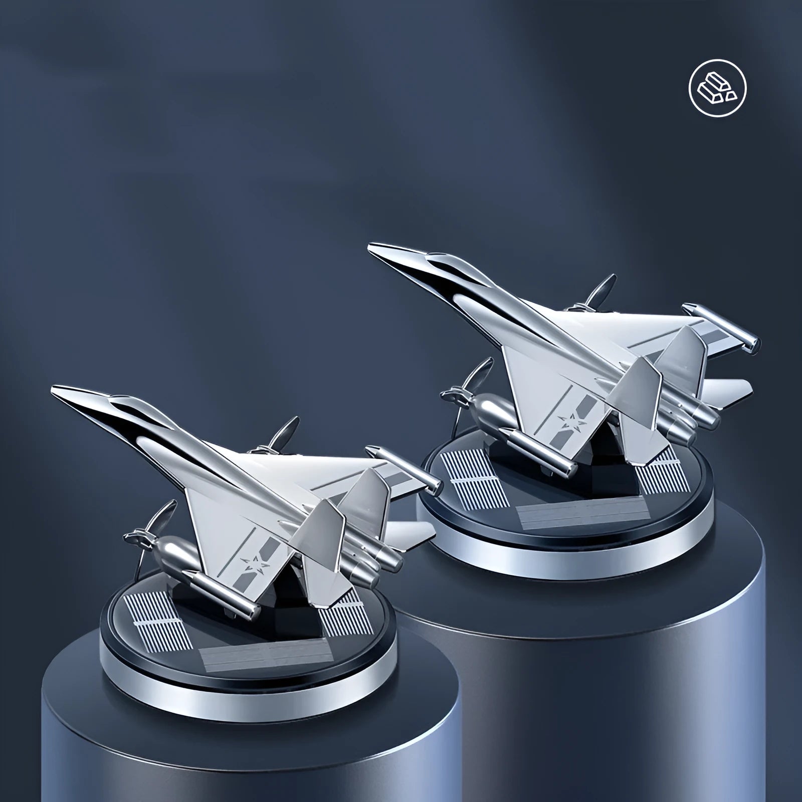 Silver solar-powered rotating fighter aircraft perfume ornament on a surface.
