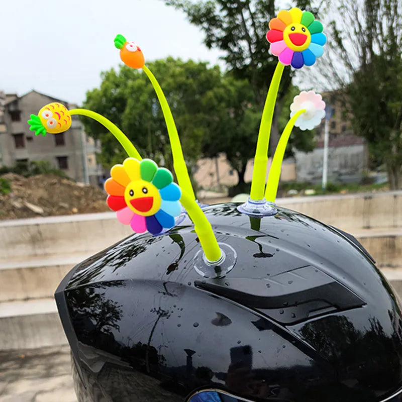 Silicone swinging sunflower decoration with suction cup for helmet personalisation.