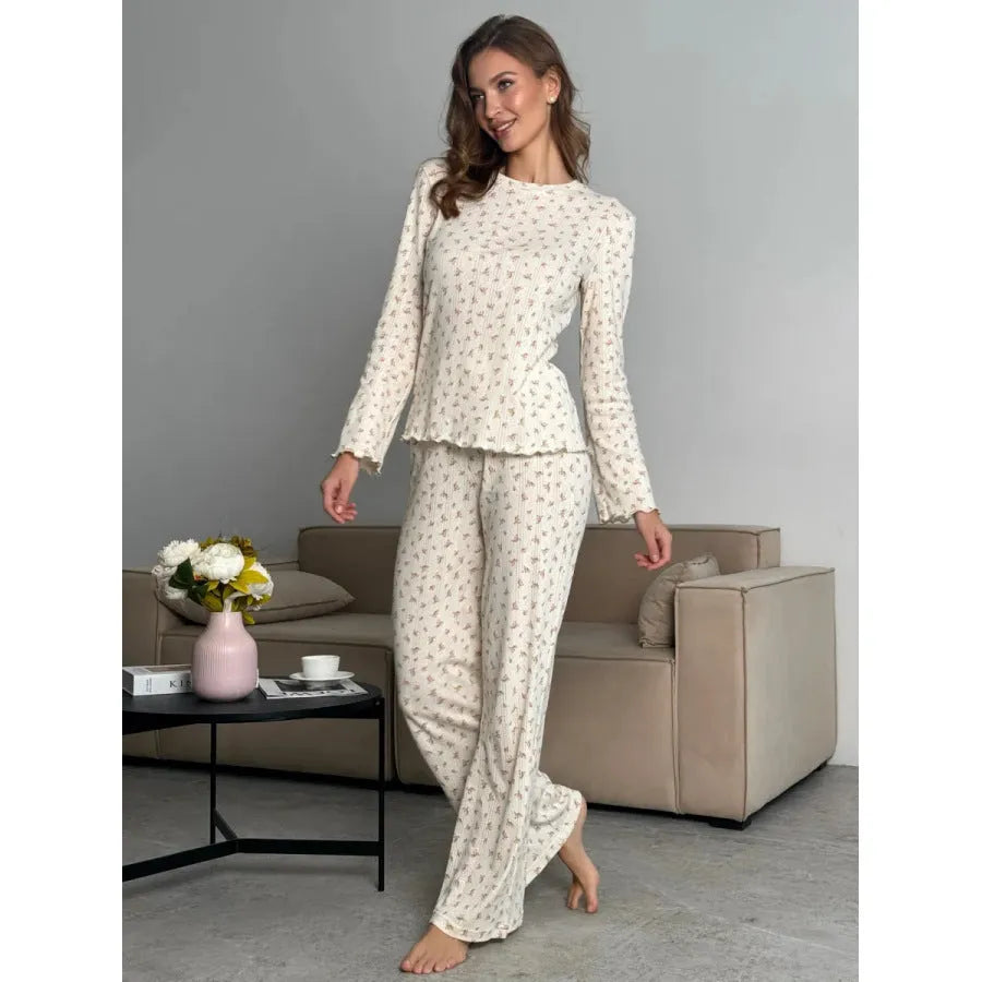 White floral print women's co-ord suit with bell sleeve top and wide leg trousers