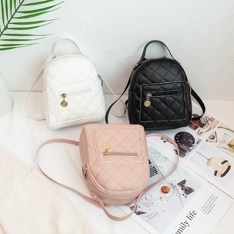Girls' hard square embroidered backpack in white colour showing front design and soft handle.