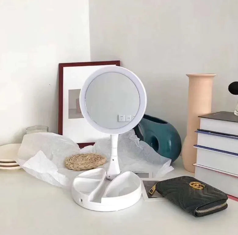 White acrylic LED vanity mirror with foldable design and USB charging port
