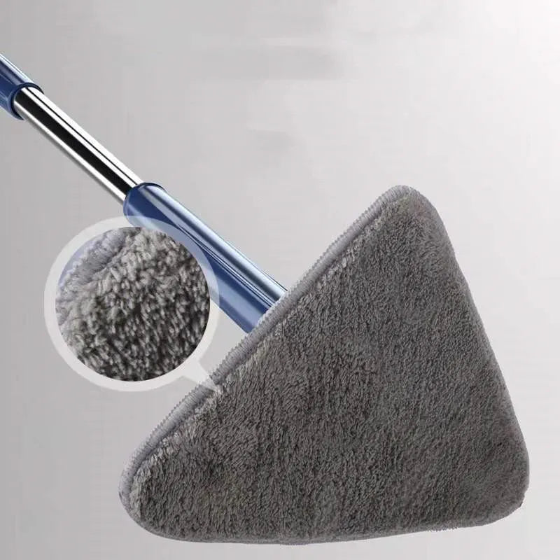 Blue extendable triangle cleaning mop with rotating head and stainless steel pole on a tiled floor.