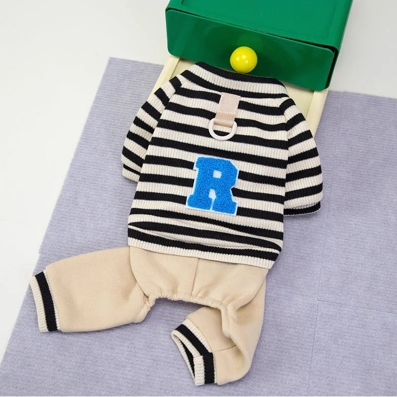Small medium dog wearing striped four-legged hoodie jumpsuit in black beige colour for autumn winter