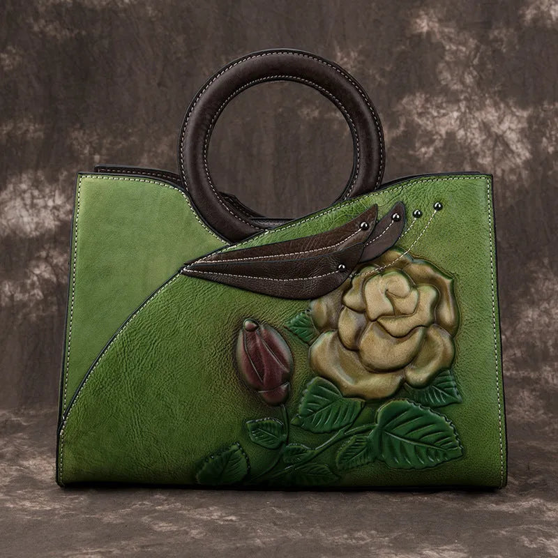 Handmade genuine leather women's handbag in contrasting colour with floral elements and zipper closure