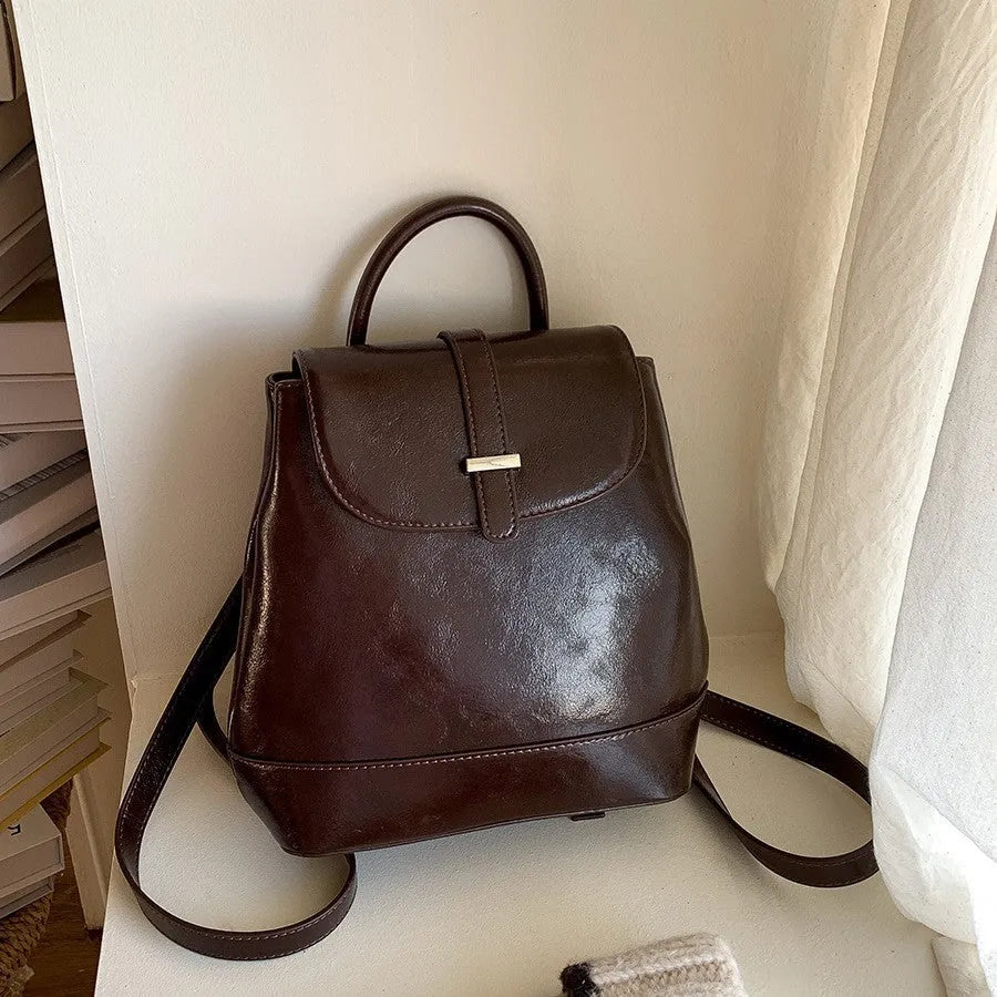 Pibai daily small backpack for women in brown with PU spliced design and compact size