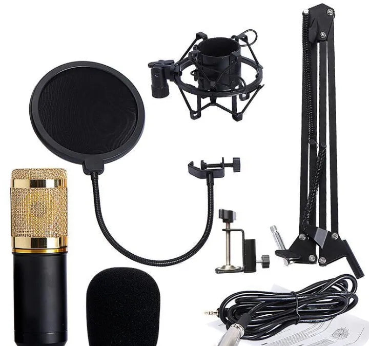BM800 condenser microphone set in black with metal shock mount and cantilever bracket on a desk