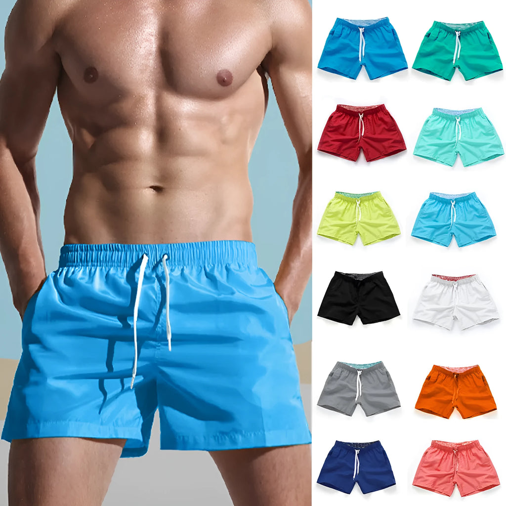Men's straight-leg polyester surf shorts on a beach, showing colour options like black, fluorescent yellow, and navy blue.