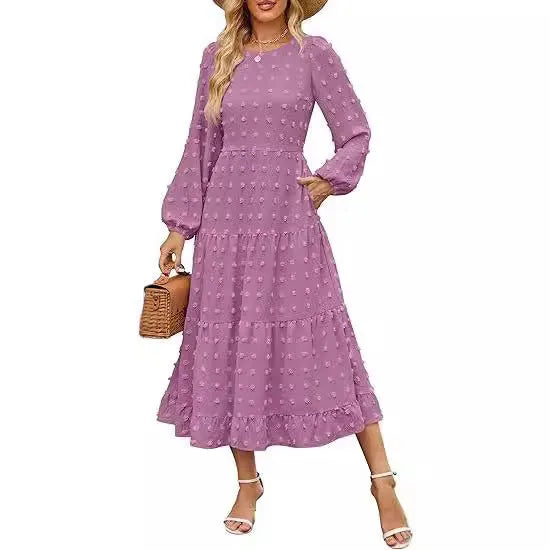 A beige high-waisted long sleeve dress with ruffled sleeves on a hanger.