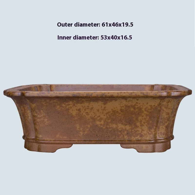 Modern rectangular purple sand floor planter with a visible water level gauge on its side.