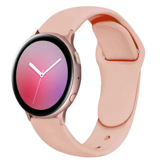Samsung Galaxy Active 2 watch with a purple reverse buckle silicone strap on a wrist.