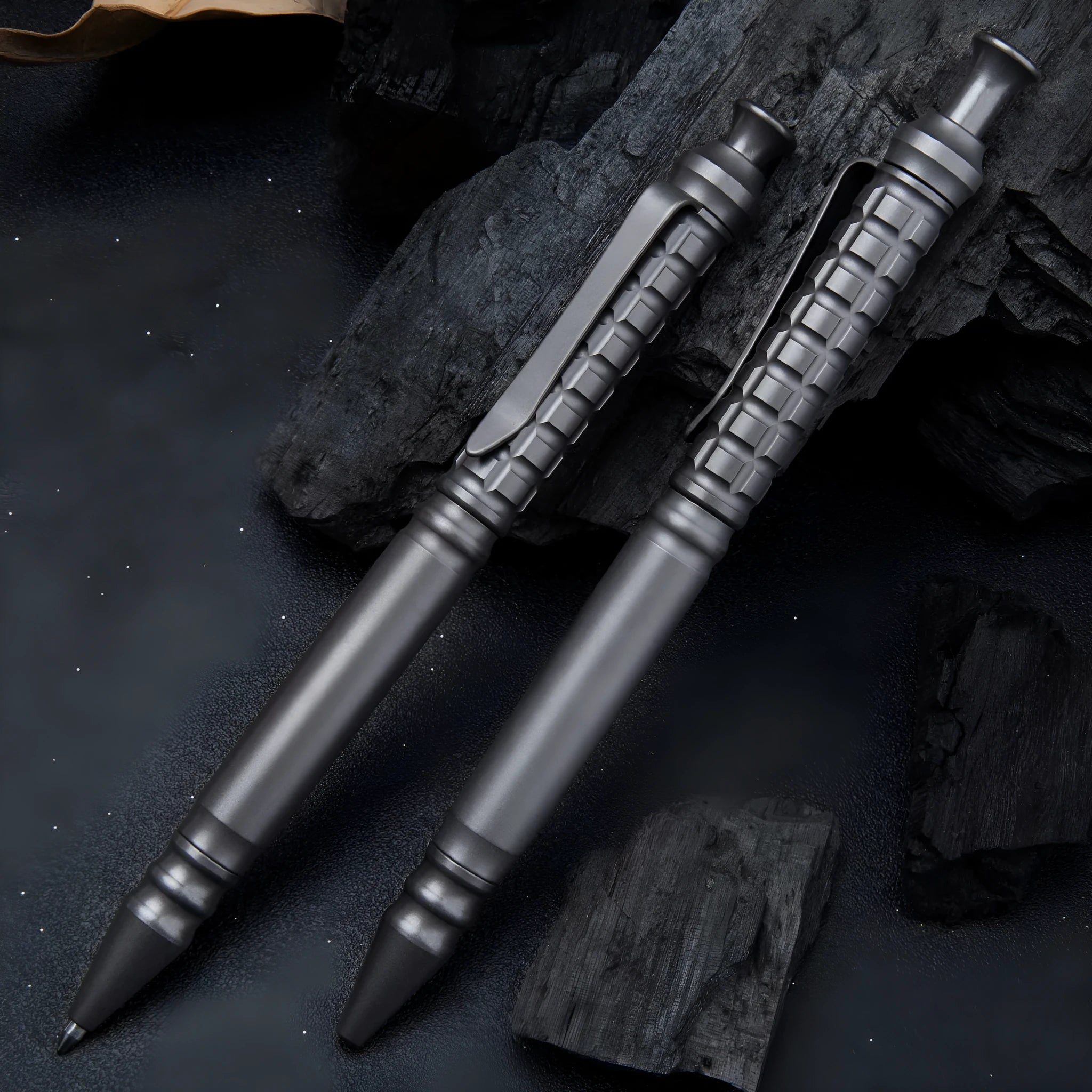 Gunmetal grey titanium alloy tactical pen with push-action mechanism and 0.5mm nib in a gift box.