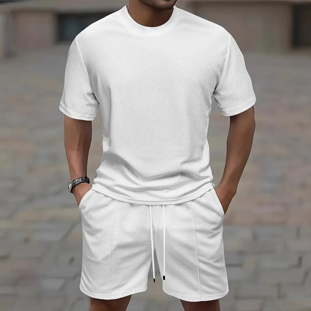 Man wearing a light apricot waffle texture short sleeve blouse and matching shorts for summer.
