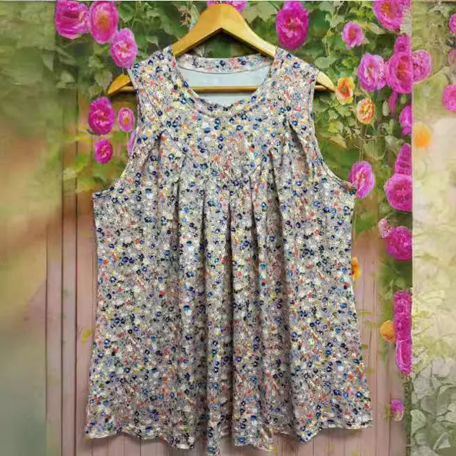 Black plus size sleeveless vest with floral print, loose fit, on a hanger.