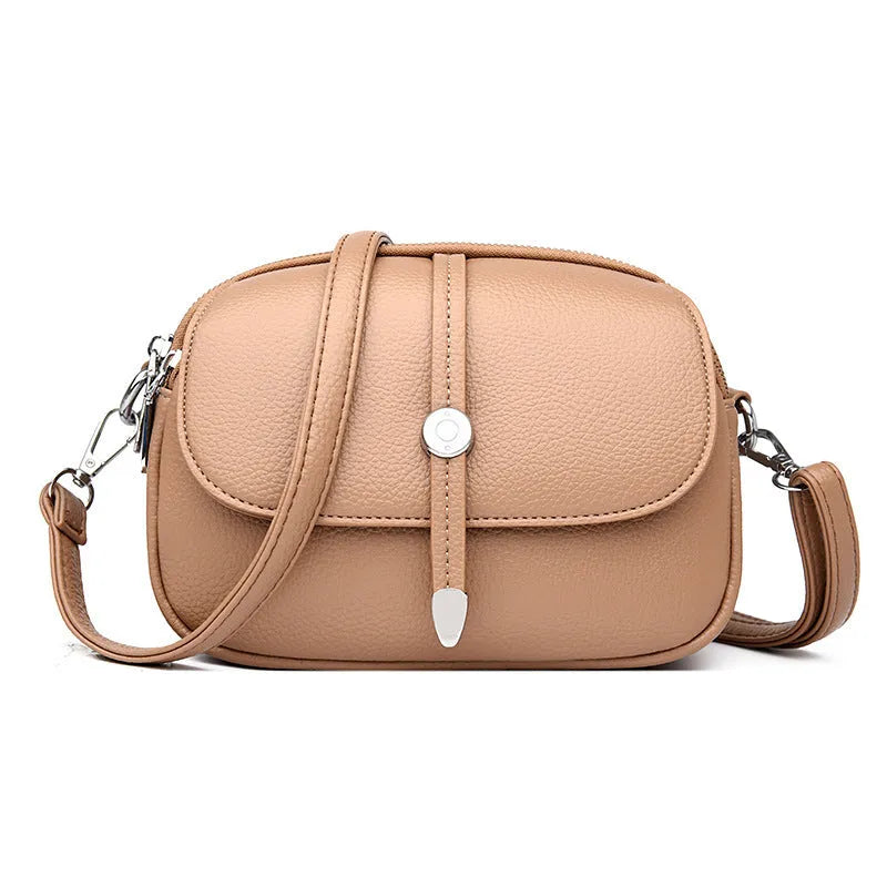 City Simple women's oval crossbody shoulder bag in soft PU leather with sewing thread details