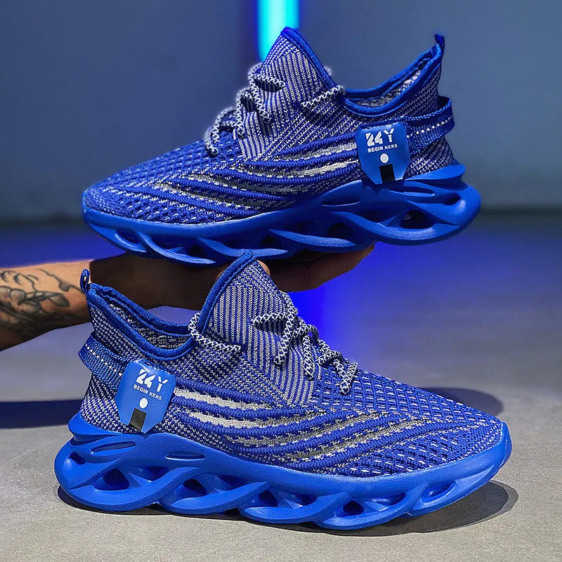Men's blue Flyknit-style mesh platform sneaker with flat foam sole on a white background.