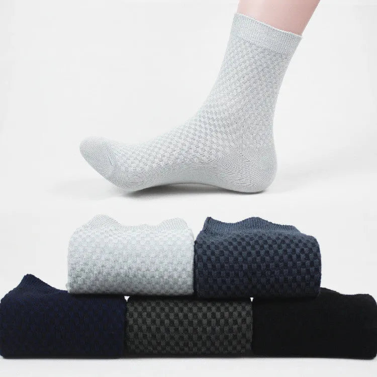 Men's bamboo fibre ankle socks in black, navy, silver grey, iron grey, and grey blue with a small square pattern.