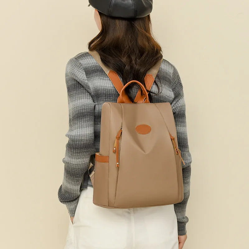 Waterproof Oxford cloth anti-theft travel backpack in urban simplicity style, available in multiple colours