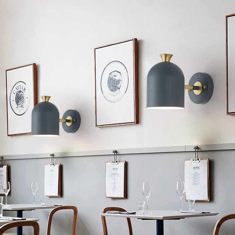 Single-head aluminium wall lamp with mirrored front in a choice of colours.