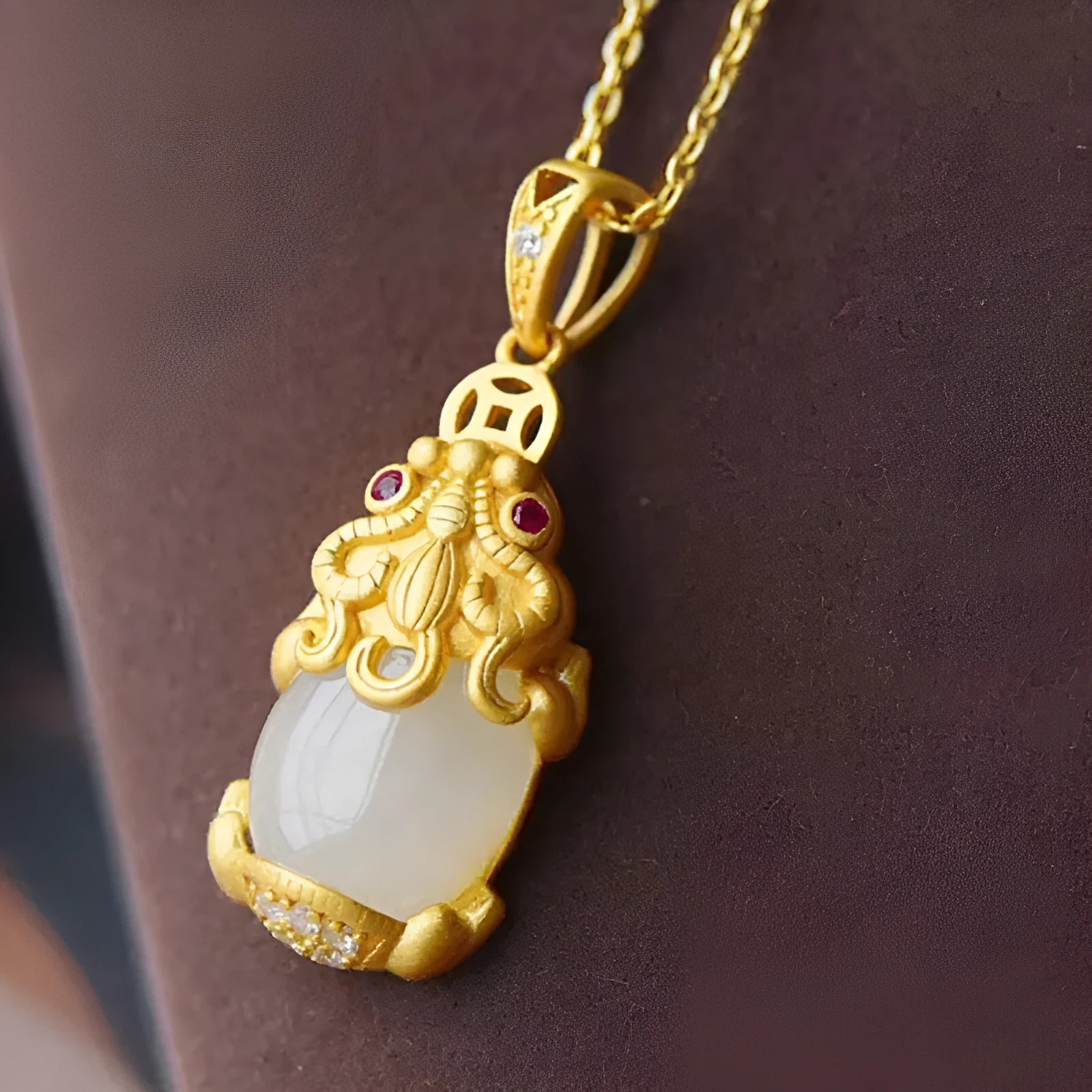 Hetian jade antique gold pendant necklace with cartoon pi xiu design and cross chain.