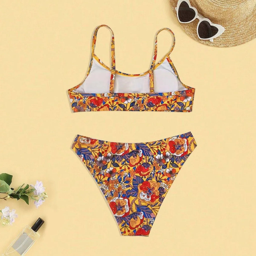 Plus size floral print strap women's bikini swimsuit with briefs style on a hanger.