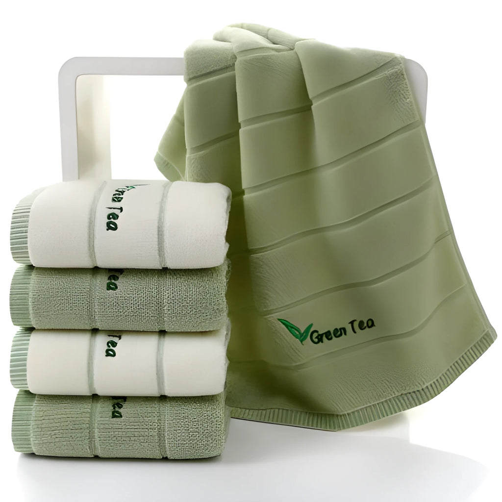 Pure cotton 32 strand embroidered face washing towel in green, 34x74cm, folded on a surface