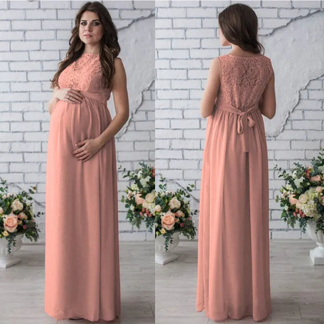 White polyester lace sleeveless maternity dress on a hanger