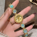 Women's quartz watch with 25mm round dial in zinc alloy case, shown in multiple colours.