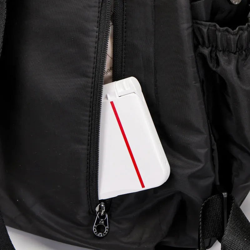 Large lightweight nylon backpack in black, shown with a sandwich pocket and main compartment.