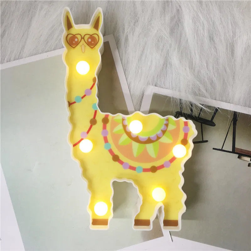 Alpaca night light 19cm tall in white colour on bedside table