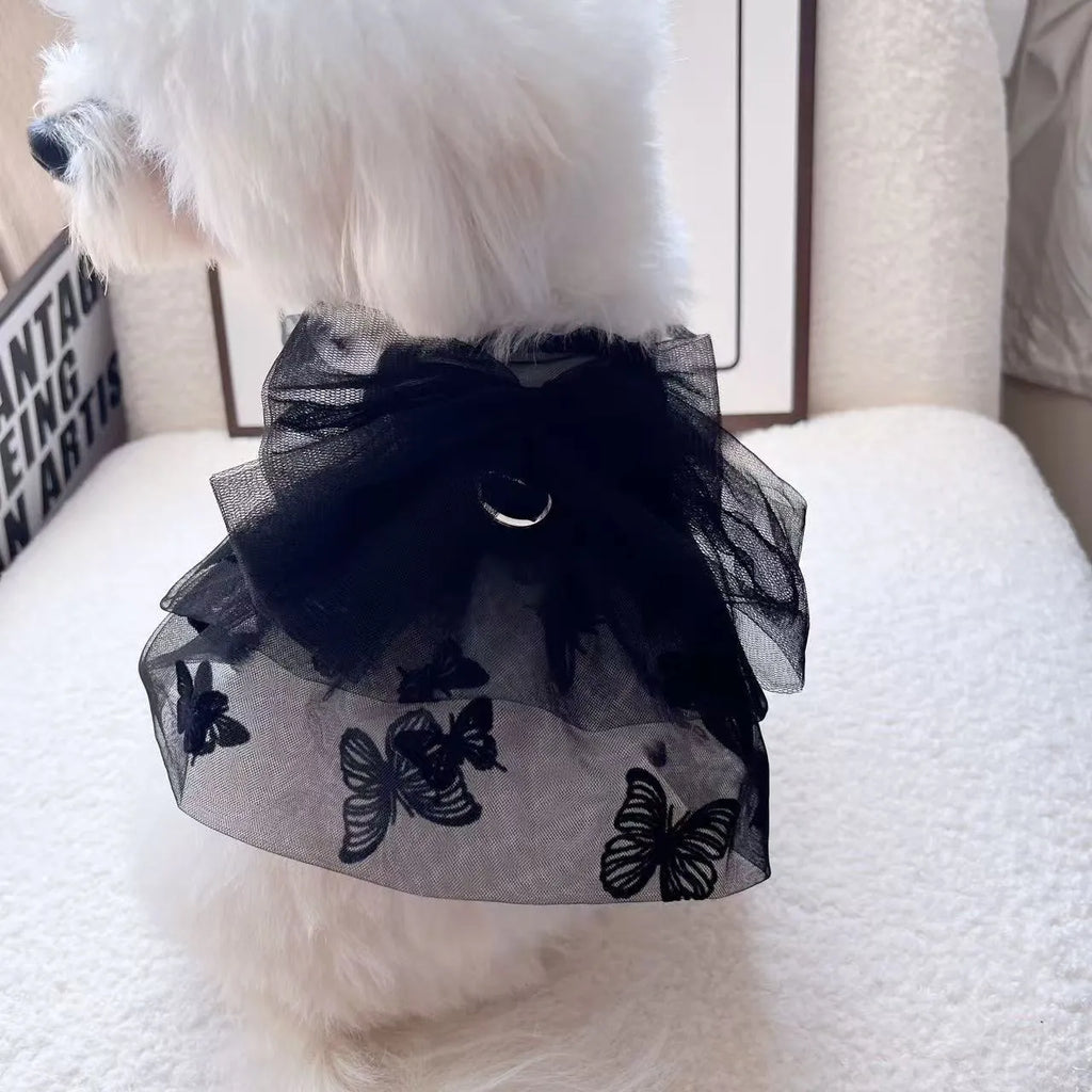 Black layered tulle princess skirt on a small dog, showing chest fit and back length.