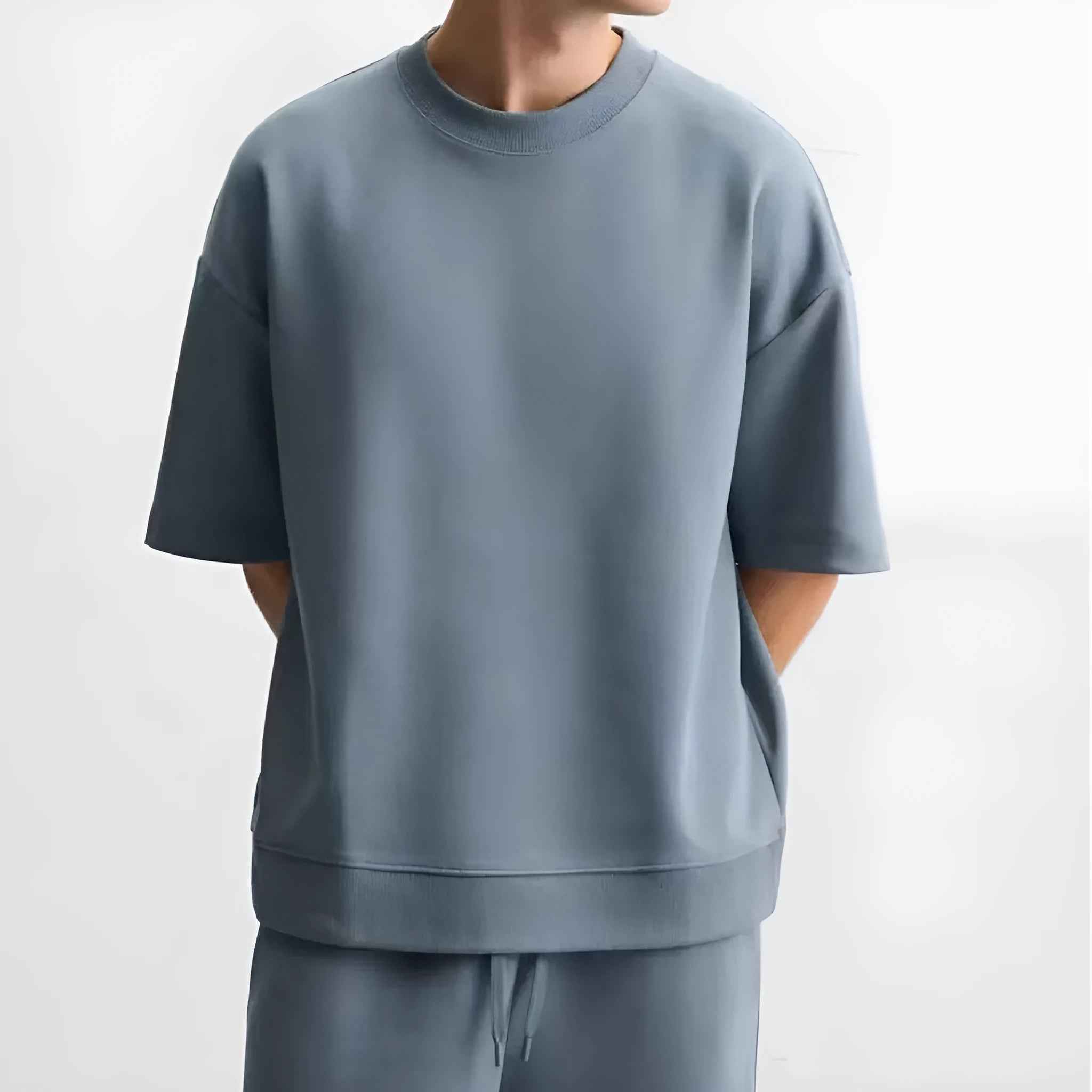 Loose double-sided cloth texture short sleeve shirt and matching shorts casual set on a hanger.