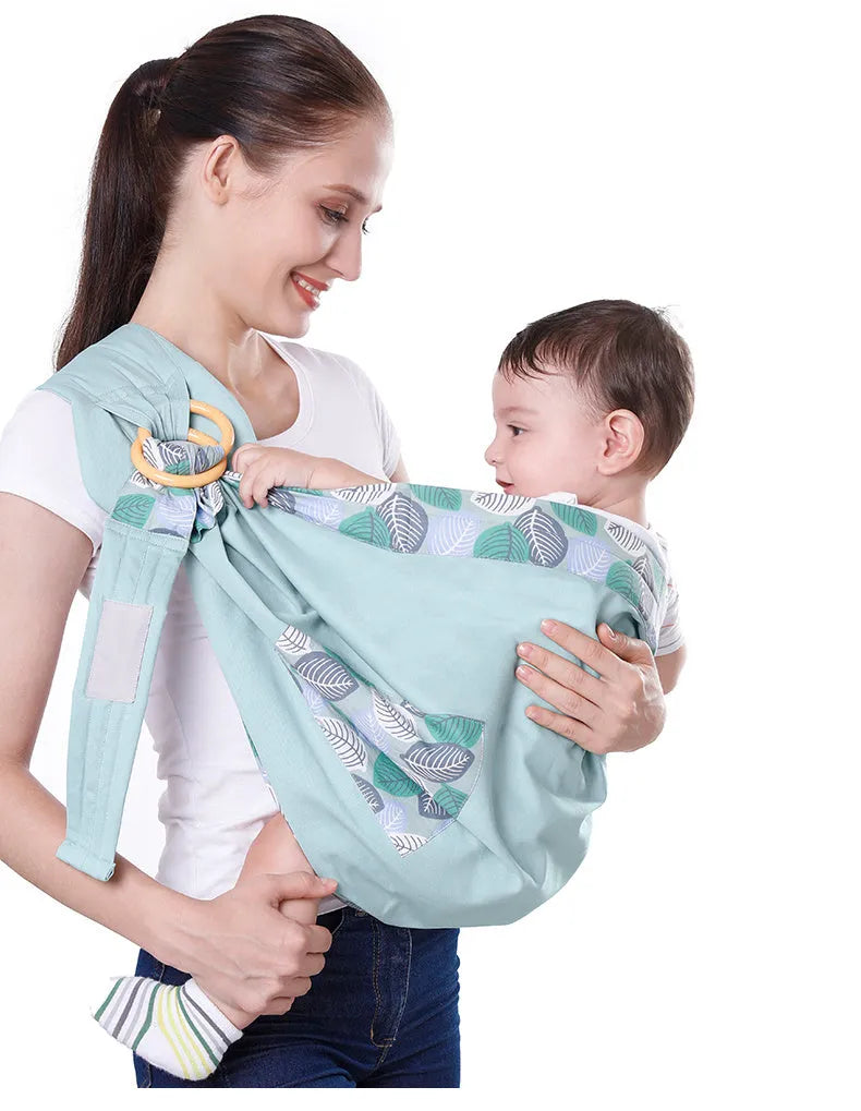 Adjustable baby wrap carrier sling shown in blue-green colour, suitable for newborns up to 36 months