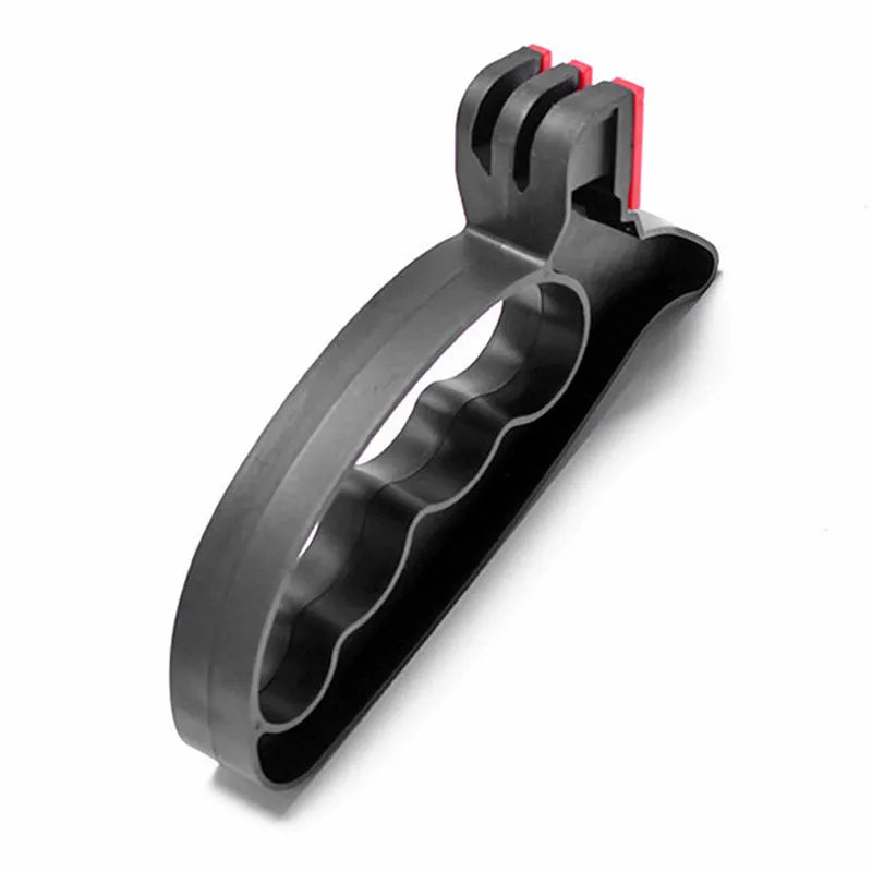Black handheld knife and scissor sharpener with ergonomic handle on a plain background.