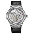 Men's automatic skeleton watch with diamond accents on a white metal case and strap.