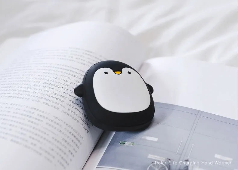 Cartoon penguin polar bear USB rechargeable hand warmer power bank showing black, white, and white-black colour options
