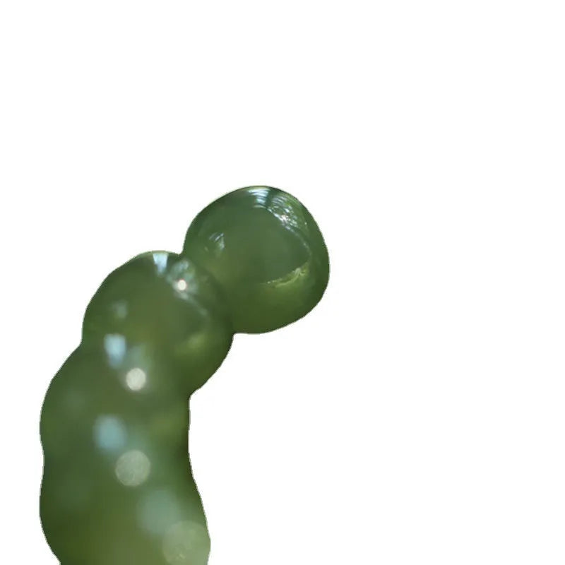 Green Hetian jade bracelet with vintage ethnic style beads on a string.