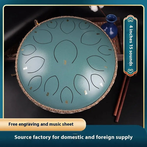 14-inch 15-tone hollow drum percussion instrument in malachite green finish on a wooden surface