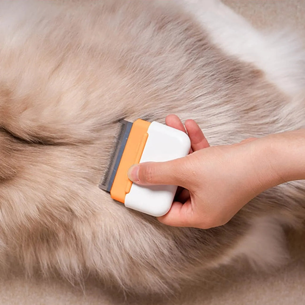 Blue dual-sided pet grooming comb showing massage and deshedding sides for cats dogs rabbits
