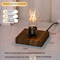 Creative iron art suspension bulb night lamp on a black wood grain desk base