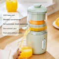 Green portable electric fruit juicer with USB-C charging and automatic pressing mechanism