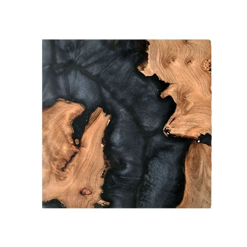 Solid colour resin coaster on a wooden table next to a mug, showing round tumour green and black options.