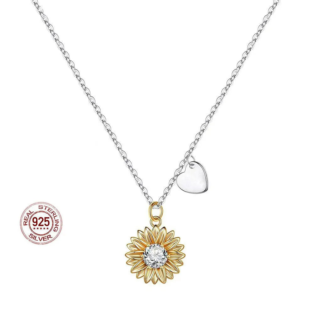 Adjustable 925 silver sunflower necklace with daisy-petal pendant on a cross chain.