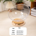Transparent acrylic bathtub-shaped cat space capsule on a wood board base.