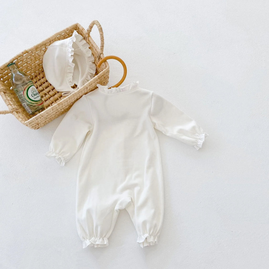 Beige knitted cotton baby jumpsuit with wooden ear collar and lace, long sleeves, hood, on a neutral background